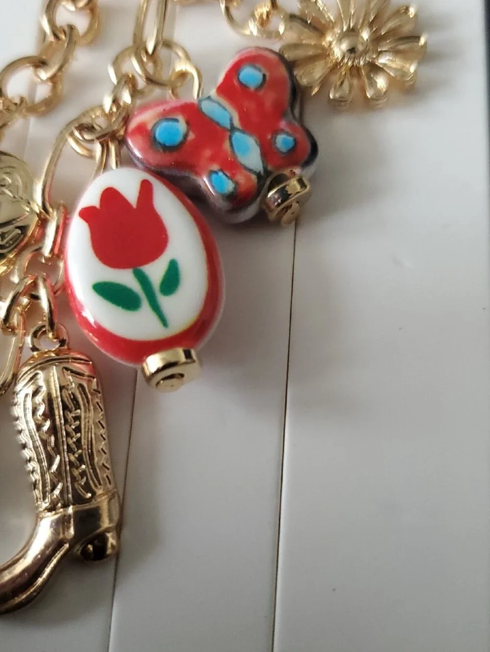 Lane Bryant Gold-Tone Charm Keychain with Red and Blue Accents